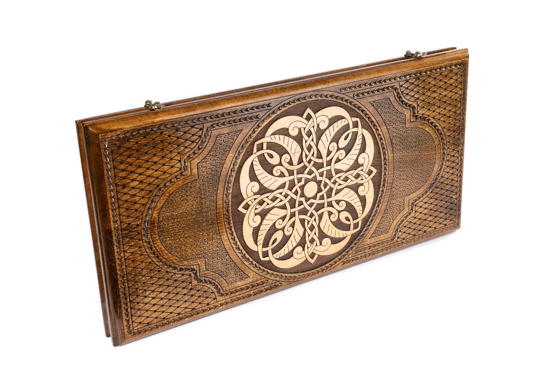 Close-up of the intricate ornamental carvings and precise wood finish on the backgammon set exterior.