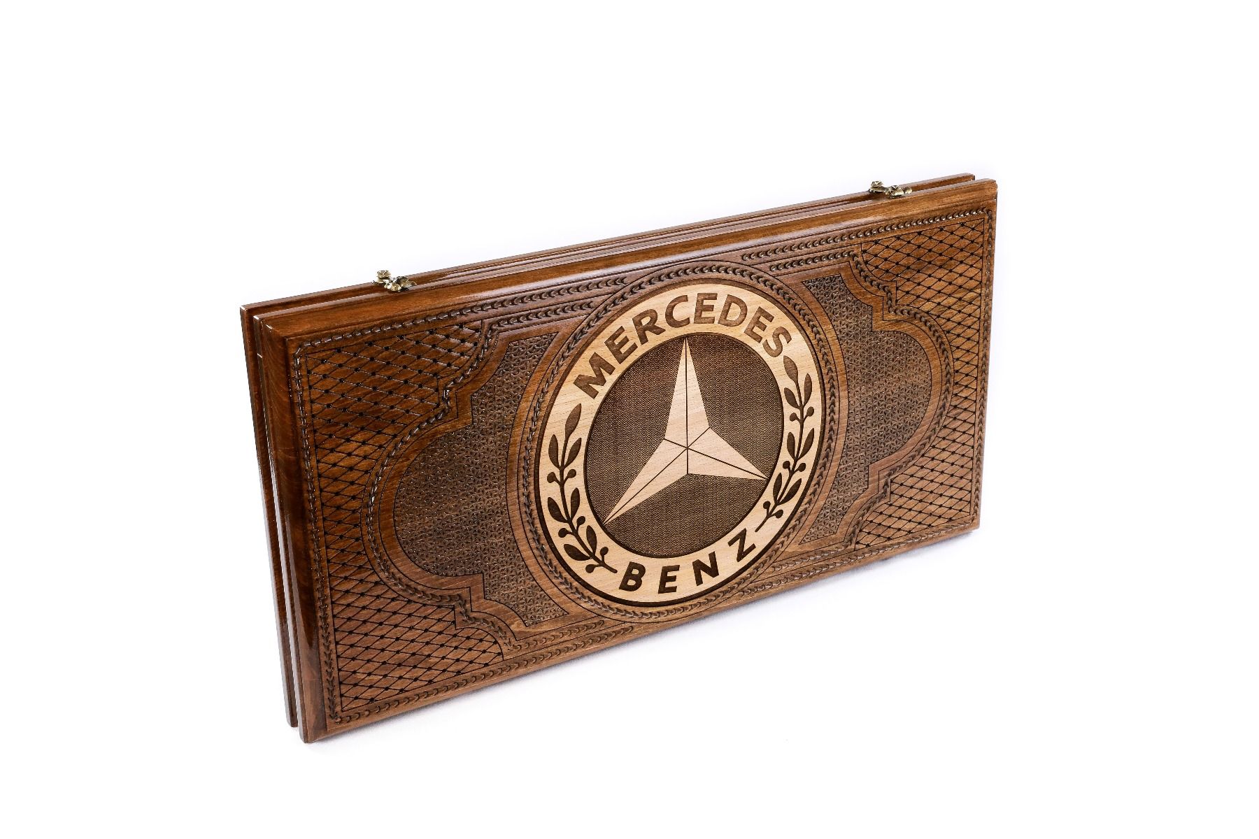 A close-up of the Mercedes emblem carving, showcasing the precision and depth of the solid wood craftsmanship.