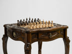 Carved lion-head leg detail of the luxury chess table