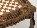 Carved border detail of the bronze-piece chess table